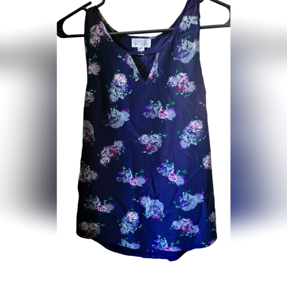 Market spruce tank with flowers